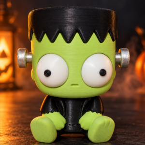 Figura decorativa de Frankenstein impresa en 3D, color verde y negro, con grandes ojos y tornillos laterales