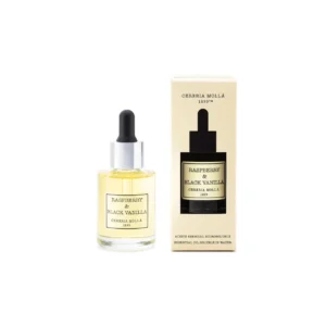 Esencia aromática Raspberry & Black Vanilla de Cerería Mollá, frasco con cuentagotas y su caja crema
